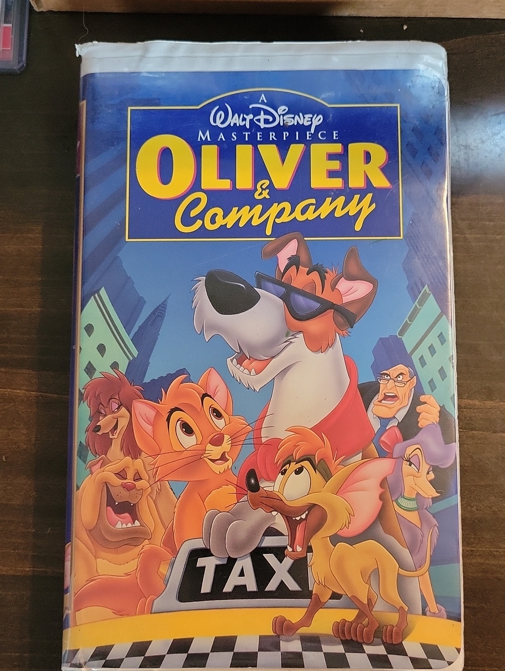 Disney Oliver & Company VHS Cover with Blue and Yellow Artwork